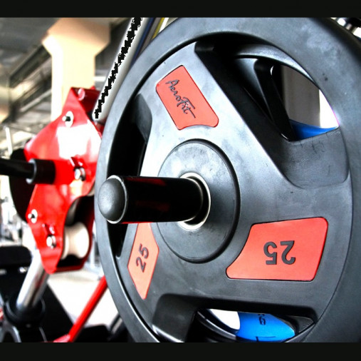 Олимпийский обрезиненный диск AeroFit 1.25 кг, черно-желтый. Посадочное кольцо из нержавеющей стали, Ø 51,5 мм